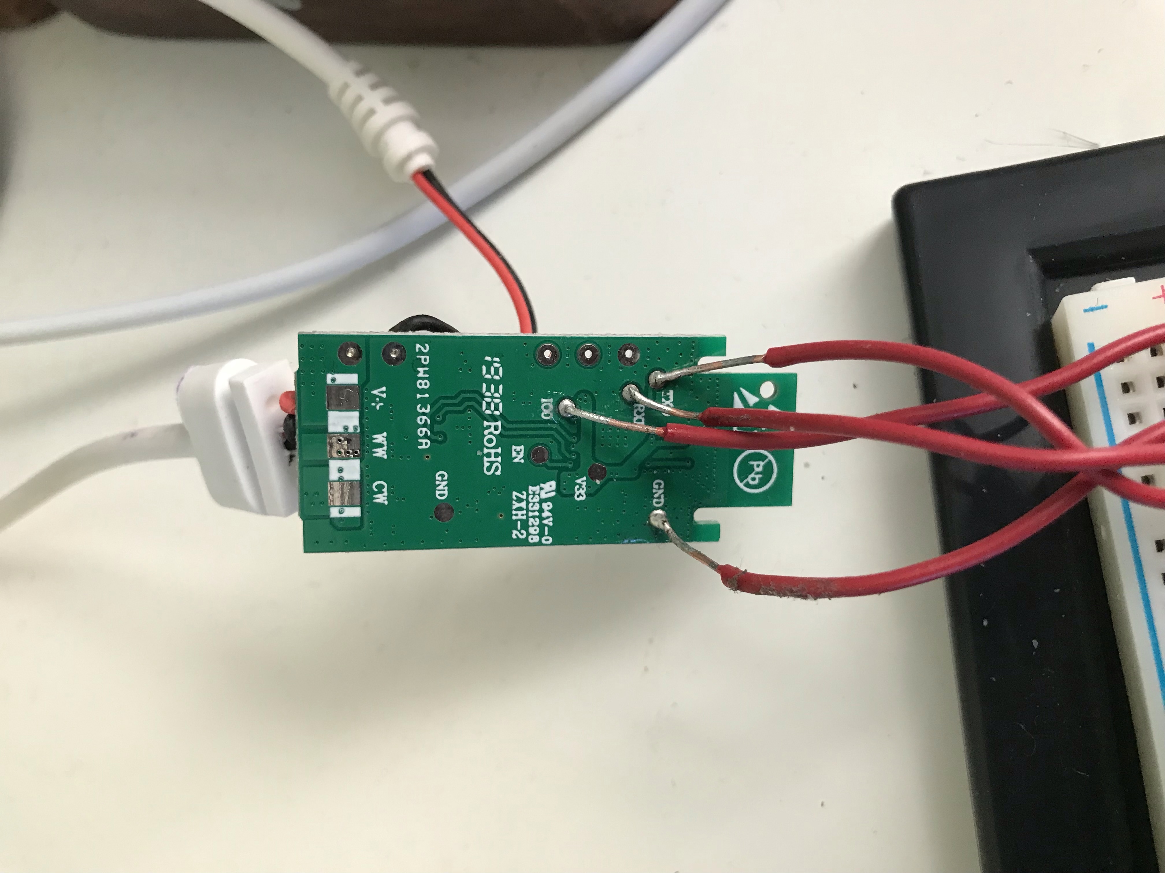 Leads soldered onto the Magic Home LED controller ESP8285 chip