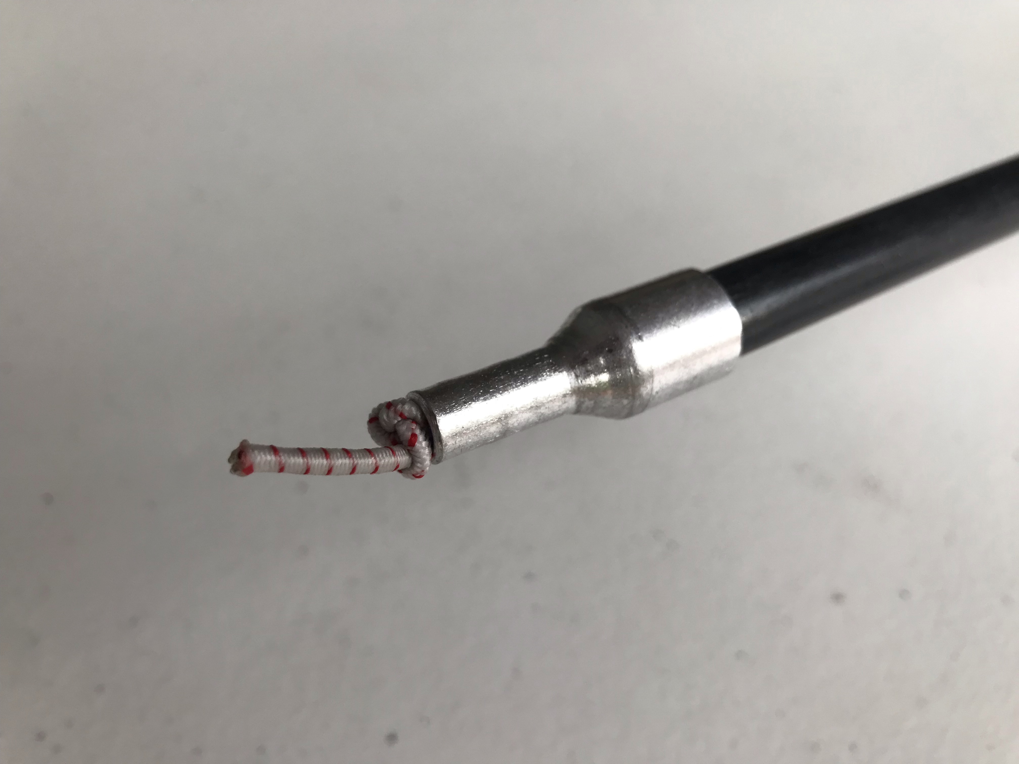 Shock cord tied after the pin end
